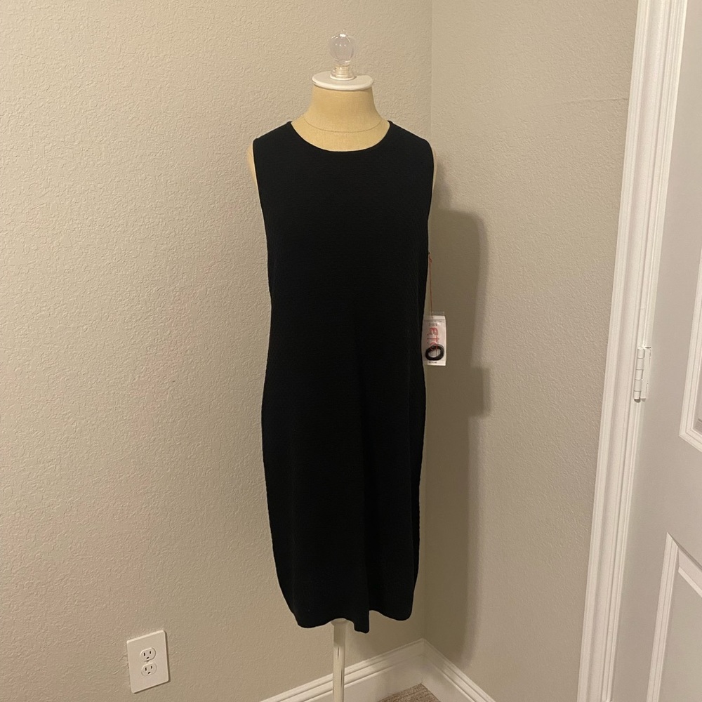 NWT ETC black sleeveless dress with a cutout in the bag